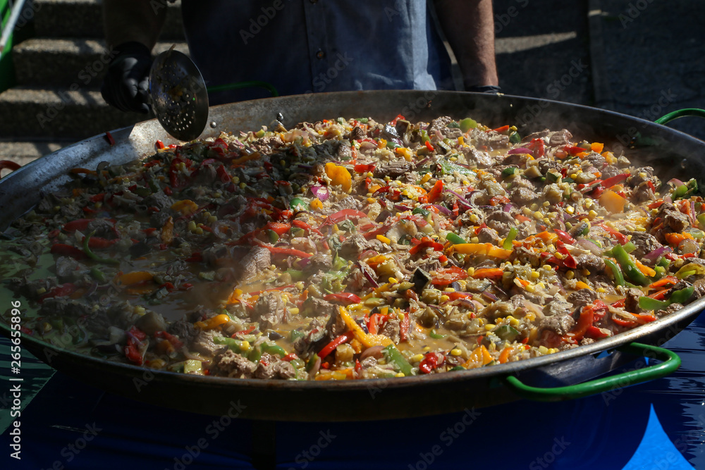 A dish of rice, vegetables and meat A dish of rice, vegetables and meat