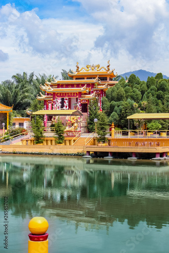 Wall murals View of a beautiful chinese temple and a clear pond in Seen  Hock Yeen Confucius Temple in Chemor, Perak, Malaysia from flowery  walkways. - Nikkel-Art.com