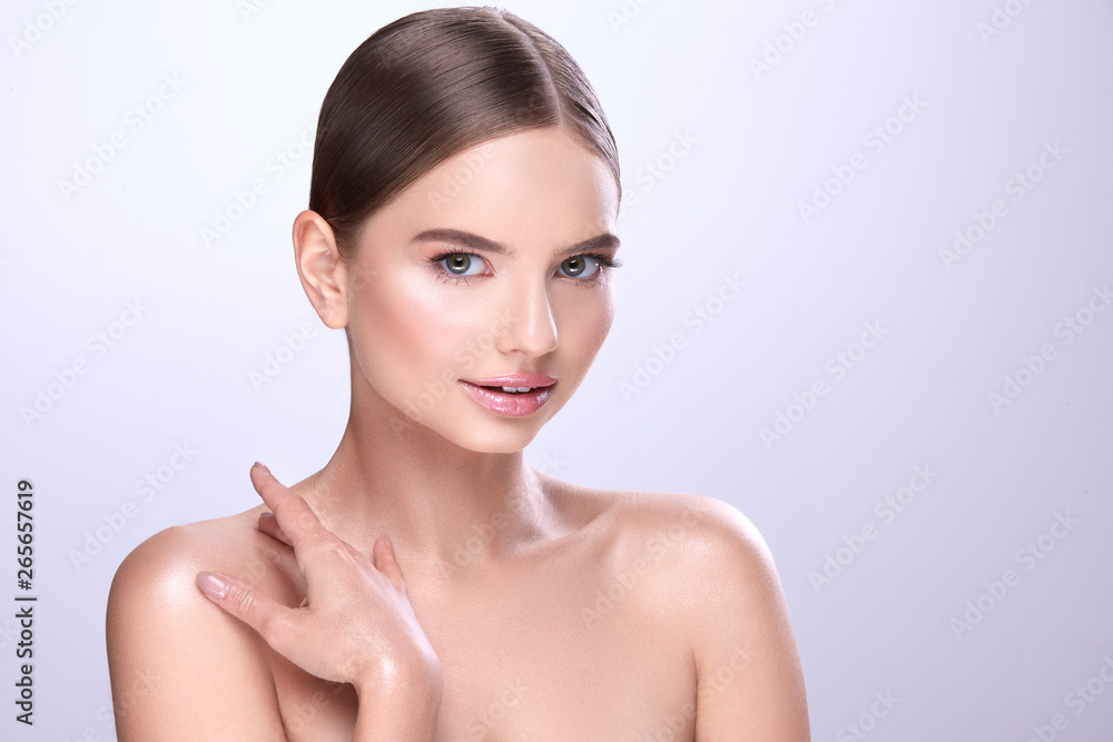 Cute make up model posing at gray studio background Cute make up model posing at gray studio background
