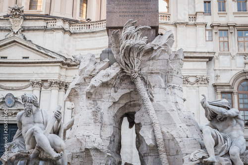 Statues at the foot of the obelix of Piazza Navona in Rome