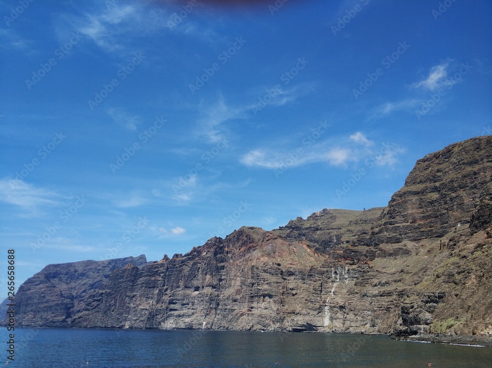 beautiful view of the mountains of Los Gigantes on the island of Tenerife against the blue sky beautiful view of the mountains of Los Gigantes on the island of Tenerife against the blue sky