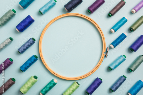 colorful sewing threads with empty space for text, top view