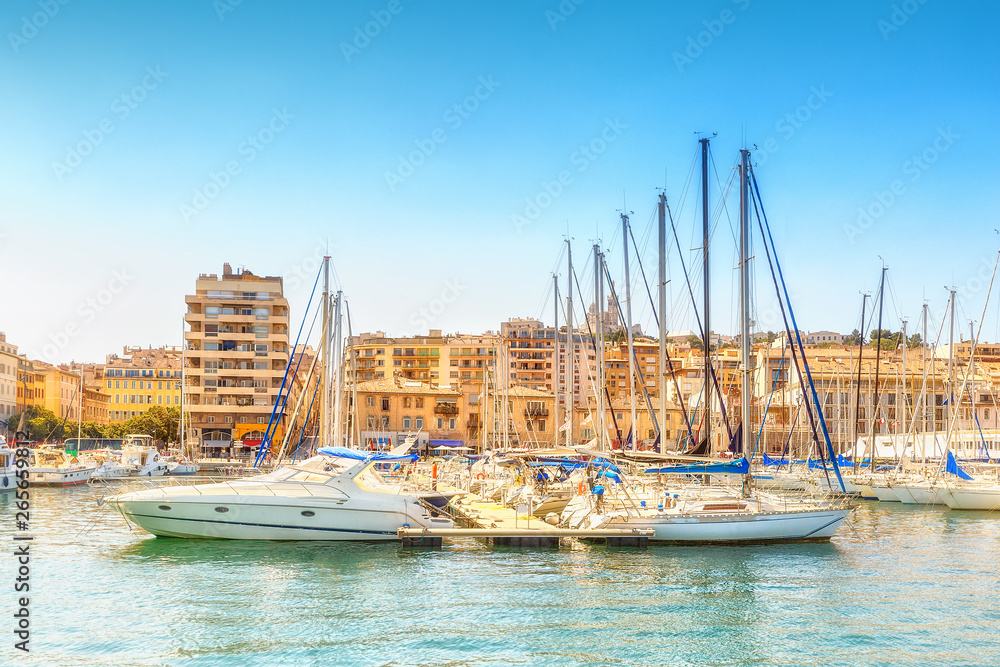 View on yachts in Marseille harbour, France. Beautiful summer scenery with armored luxury yachts.