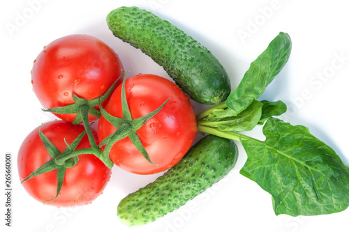 Three red ripe tomatoes