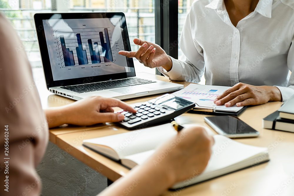 Business adviser analyzing financial figures denoting the progress Internal Revenue Service checking document. Audit concept Business adviser analyzing financial figures denoting the progress Internal Revenue Service checking document. Audit concept