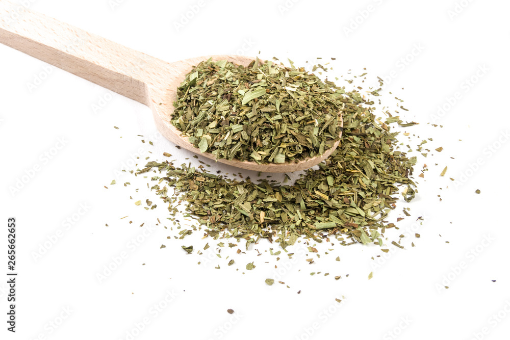 tarragon on wooden spoon on white background tarragon on wooden spoon on white background