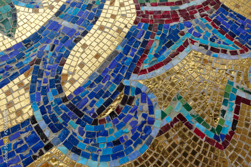 Mosaic fragment. Floral ornament blue on a golden background.