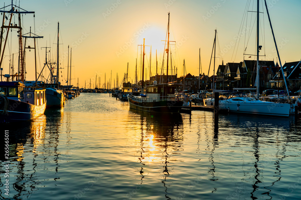 Harbor of the idyllic y small fisher town Urk with wonderful evening light - obrazy, fototapety, plakaty 