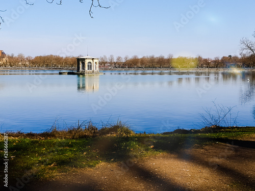 White gazebo in the middle of the river.