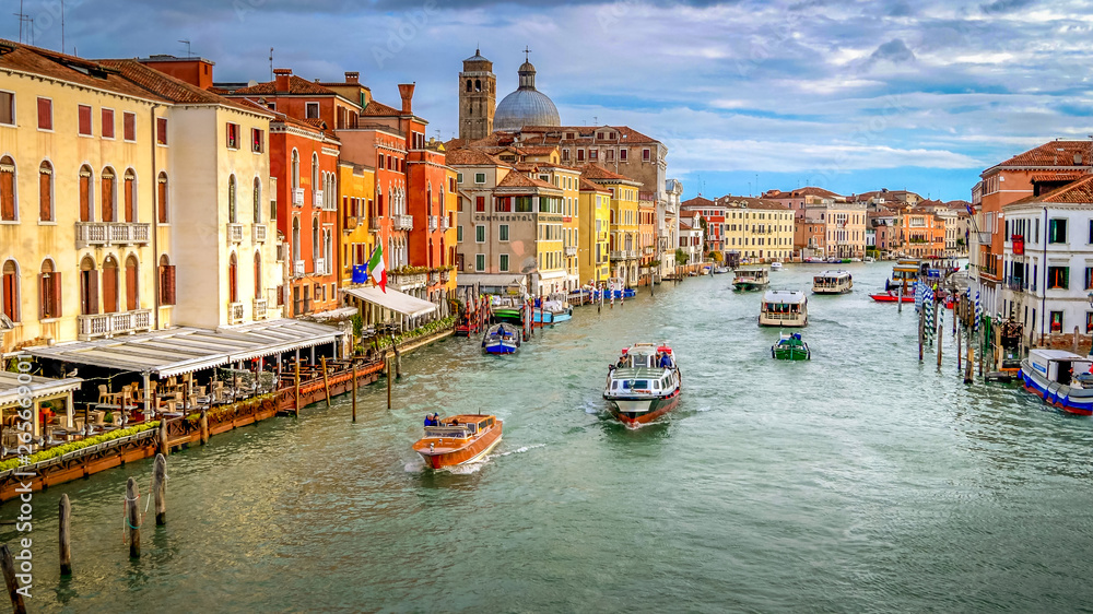 Vaporetto, commercial boats and water taxi's traverse the Grand Canal in Venice, Italy
