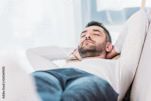 selective focus of handsome bearded man resting with eyes closed © LIGHTFIELD STUDIOS