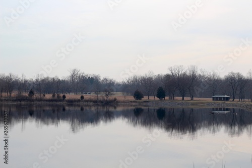 The lake and the park landscape on a cloudy day.