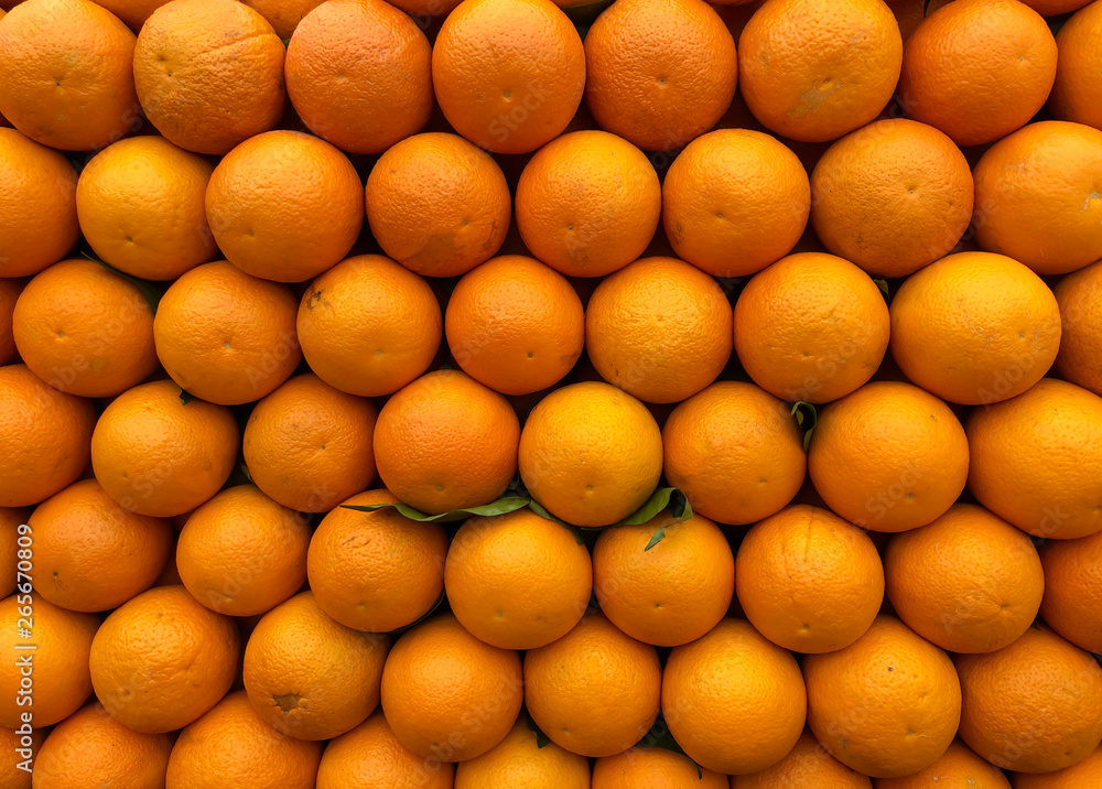 orange fruit on counter for sale and presentation style