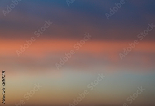 Dramatic sunset sky background with fiery clouds, yellow, orange and pink colour, nature background. Blurred background