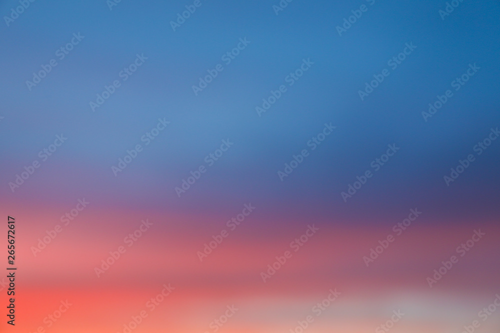 Dramatic sunset sky background with fiery clouds, yellow, orange and pink colour, nature background. Blurred background Dramatic sunset sky background with fiery clouds, yellow, orange and pink colour, nature background. Blurred background
