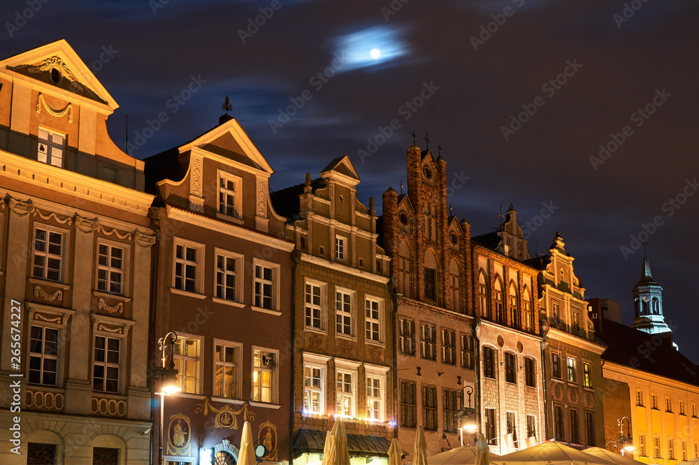 Historic Townhouses in the Old Market Square  at night in Poznan.