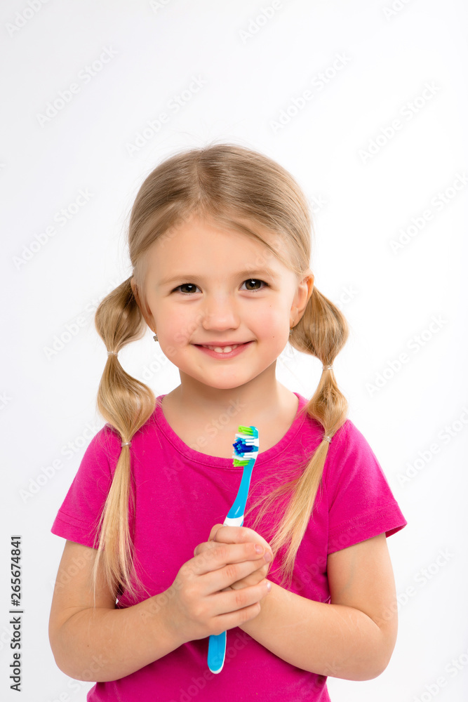 Happy little girl standing with toothbrush isolated on white.little child brush his teeth.Cute little girl is brushing teeth with a smile.dental hygiene. happy little girl brushing her tooth Happy little girl standing with toothbrush isolated on white.little child brush his teeth.Cute little girl is brushing teeth with a smile.dental hygiene. happy little girl brushing her tooth
