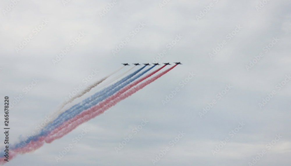 Planes making tricolor smoke trail at airshow in Saint Petersburg, Russia Planes making tricolor smoke trail at airshow in Saint Petersburg, Russia