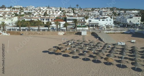 Aerial seascape, of Praia da luz (Beach and seaside cliff formations along coastline of Lagos city), famous destination in Algarve. South Portugal.
