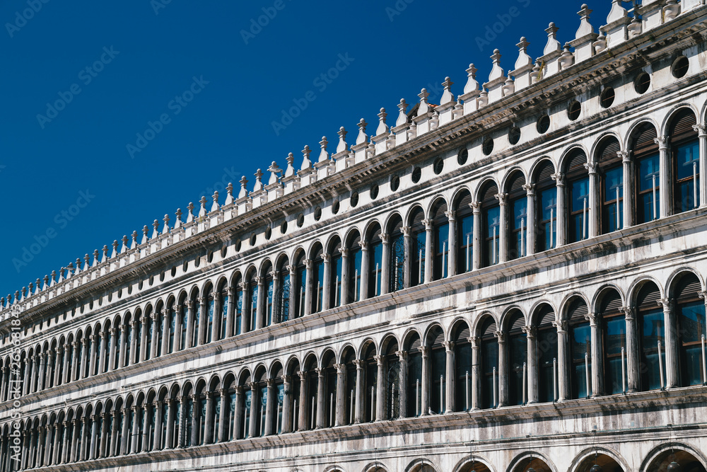 Close up of the Procuratie Vecchie on the blue sky background, the oldest of the buildings on St Mark's Square in Venice, Italy
