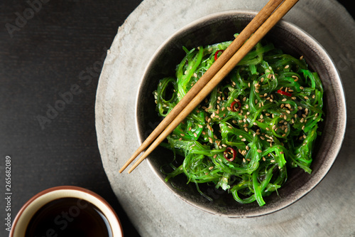 Wakame salad with sesame and chili pepper photo