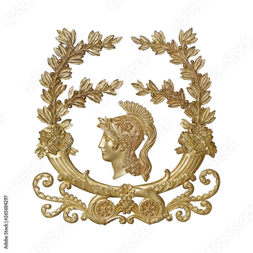 Golden decorative element of the interior with the image of the helmet from the ancient Greek myth. The element is isolated on white background