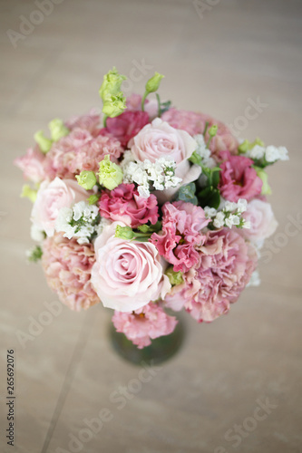 Delicate wedding bouquet in pink tones of roses and lisianthus. © ksi