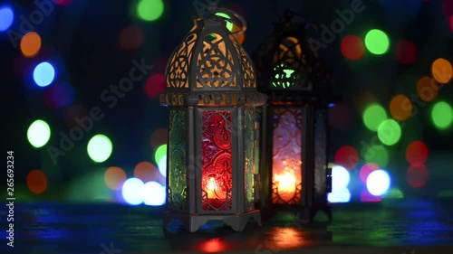 Low light studio set up shot of lighted lantern - showing ramadan kareem or eid mubarak celebration conceptual. photo