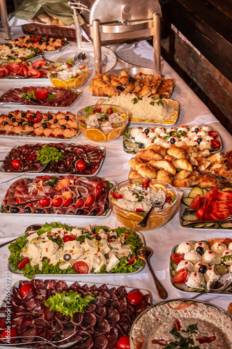 Buffet table with cold snacks and delicious appetizers. Catering food event banquet table.