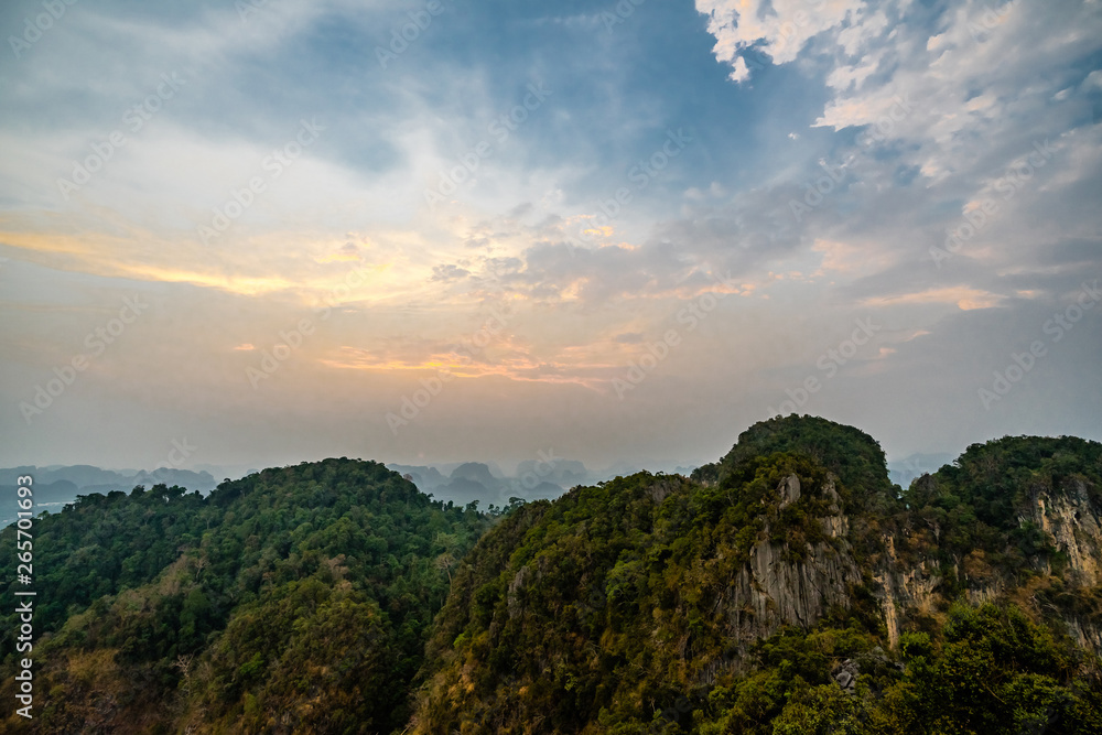 Landscape view at the top of Wat Tham Sua or Tiger Cave Temple in Krabi province. Mountains and sunset sky 