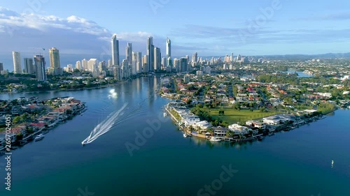Wallpaper Mural Tracking left aerial shot over a boat on the Nerang River with the Surfers Paradise skyscrapers and beaches in the background. Torontodigital.ca