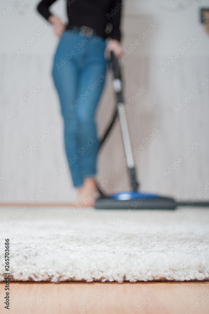 Fototapeta premium clean light carpet after vacuuming, the concept of cleanliness and order