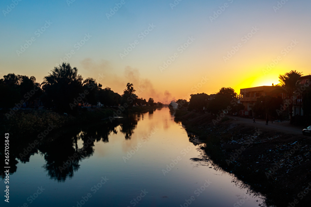 View of irrigation canal at sunset in Egypt
