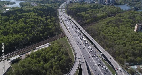 Aerial top view of road junction and  transport traffic with vehicle movement by drone. Drone video of Moscow  junction road at day time. Dmitrovskoe shosse, Russia. photo