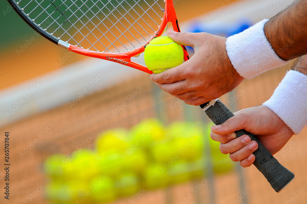 Details of tennis player hand with racket and tennis ball - obrazy, fototapety, plakaty 