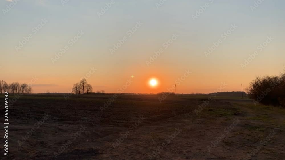 Sun setting over a latvian plain in time lapse Sun setting over a latvian plain in time lapse