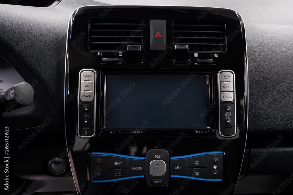 Modern car dashboard with screen multimedia. Interior detail.