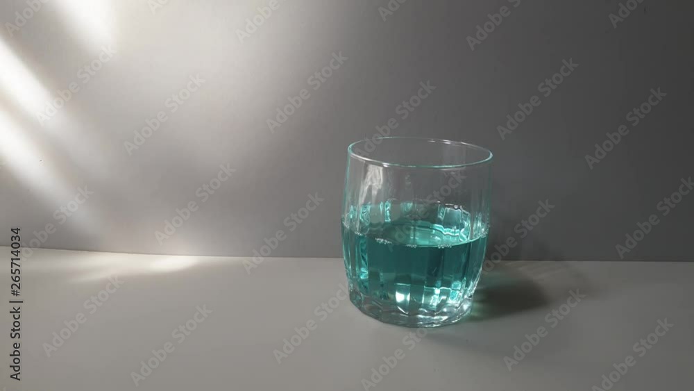 Alcoholic drink of blue color in a glass glass. Drink with ice. Alcoholic drink of blue color in a glass glass. Drink with ice.