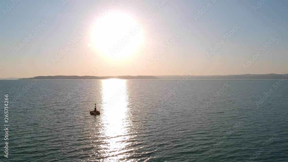 Sunset and a Bouy at the middle of the lake Balaton, Hungary Siofok Recorded with a Dji drone 1080p Sunset and a Bouy at the middle of the lake Balaton, Hungary Siofok Recorded with a Dji drone 1080p