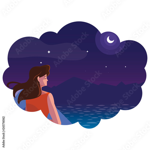 woman contemplating horizon in lake and mountains at night scene © djvstock