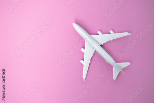 white model on pink background, travel concept