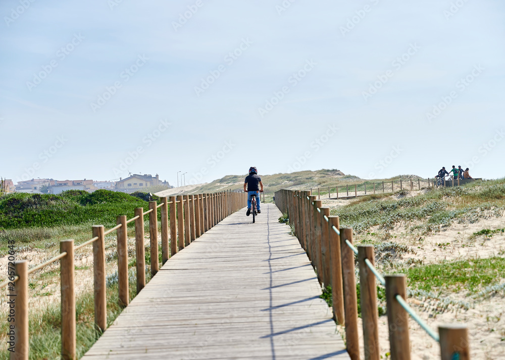 Wooden footwalk over the dunes in portugal near the beach