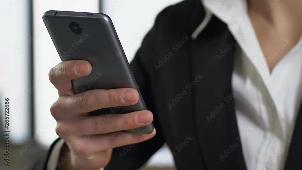 Female employee using smartphone application closeup, modern technology, gadget Female employee using smartphone application closeup, modern technology, gadget