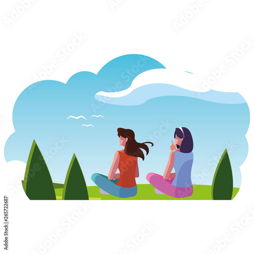 women couple contemplating the horizon in the field scene
