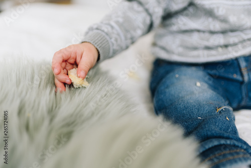Wallpaper Mural Little toddler boy's hand with a snack Torontodigital.ca