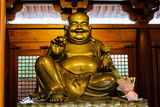 This is big statue of buddha in Jade buddha temple in Shanghai