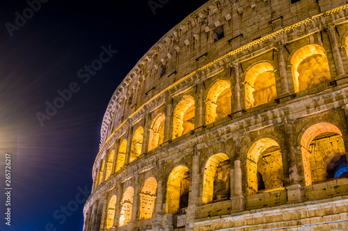 The Great Roman Colosseum and its arches at night in Rome - Italy