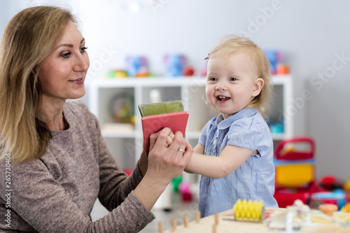Mother and child playing wi...