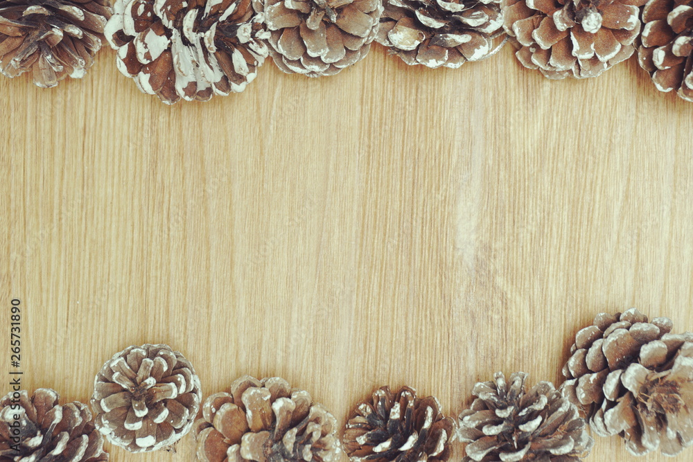 Holiday decoration with Rustic wooden background with pine cones Holiday decoration with Rustic wooden background with pine cones