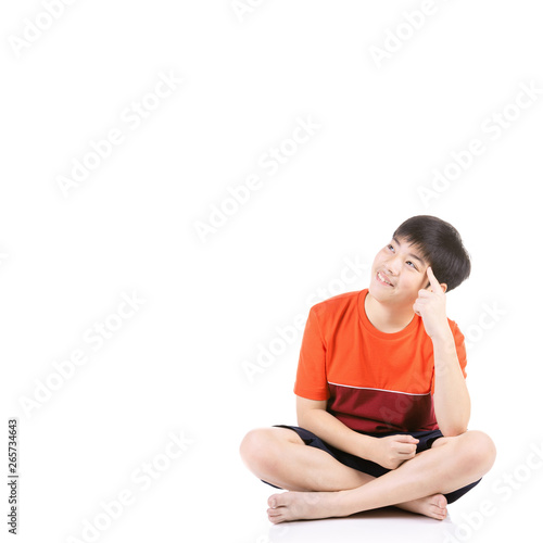 Portrait Young Asian boy sitting over white background,